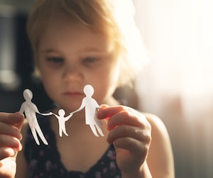 Child with paper figures