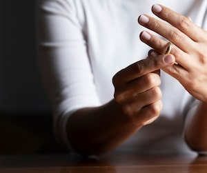 Woman taking off a ring