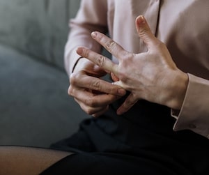 Woman taking off a ring