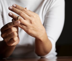 Woman taking off a ring