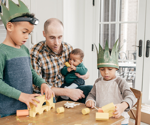 A happy family playing with toys