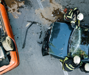 Workers helping in a car crash