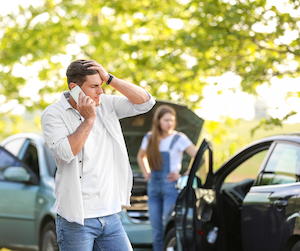 Worried on phone in a car crash