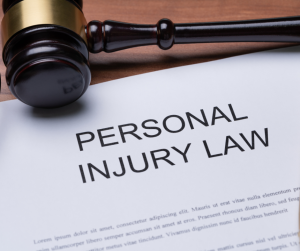 A gavel above a personal injury law document.
